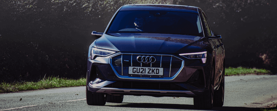 Audi e-tron Sportback driving down a road facing the camera