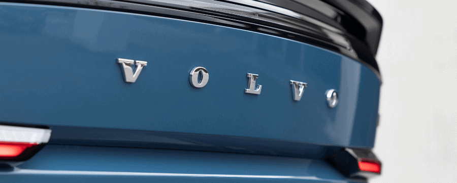 Blue Volvo car with silver volvo badging logo
