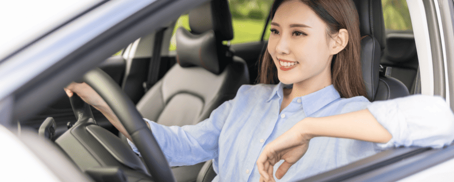 Woman smiling in car