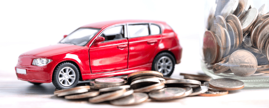 Red car on a pile of coins car subscription vs short term rental